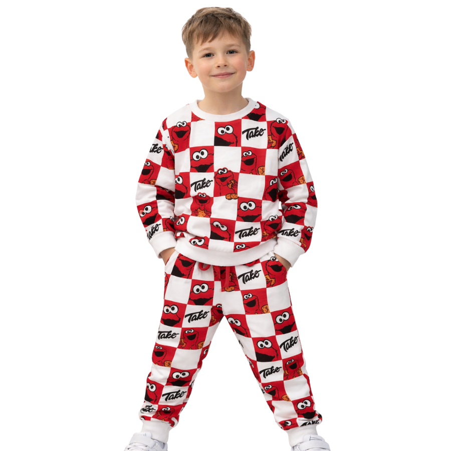 Child wearing a red and white checkered outfit with a pattern on a white background